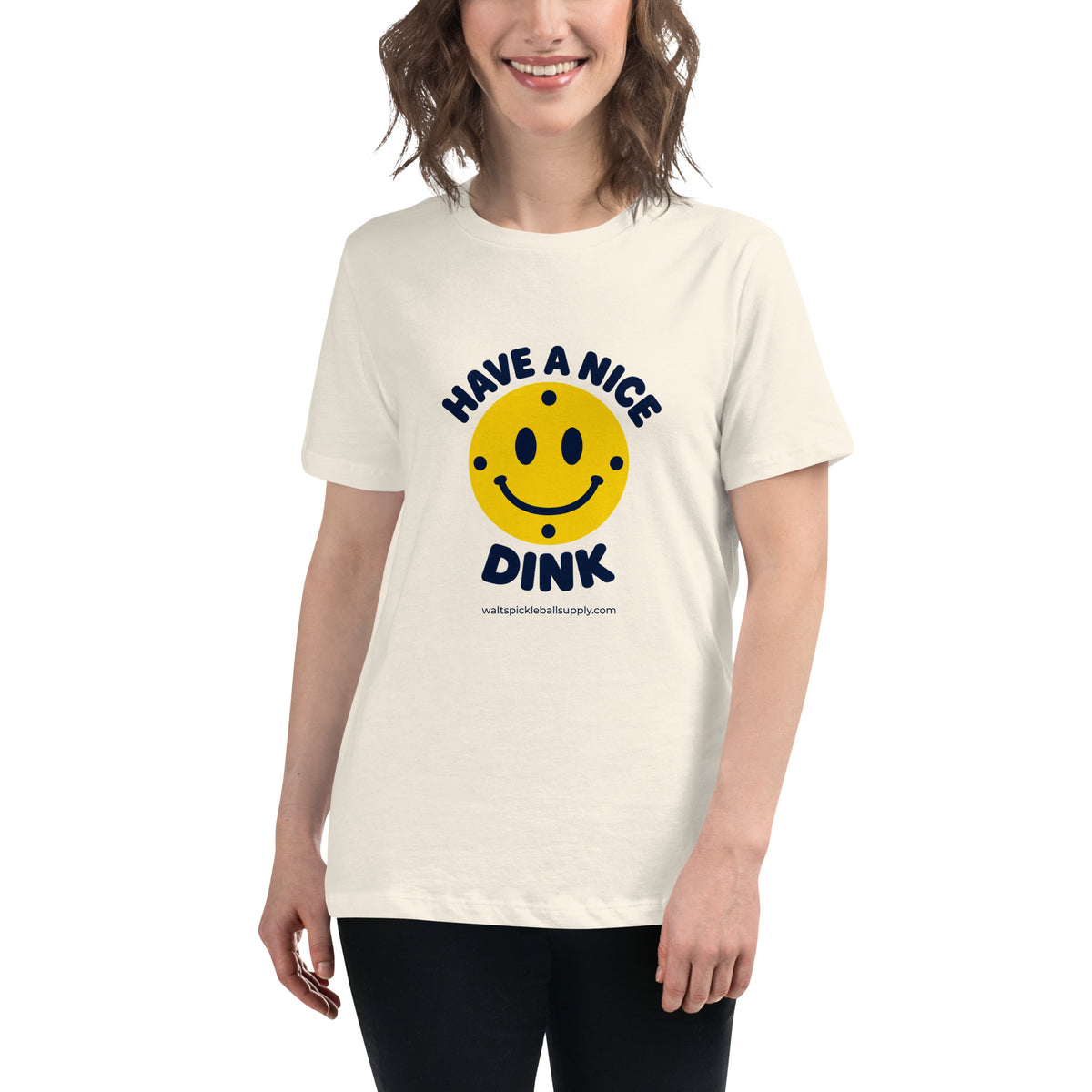 Natural Nice Dink Women's Tee modeled from the front, with a smiling yellow pickleball graphic.