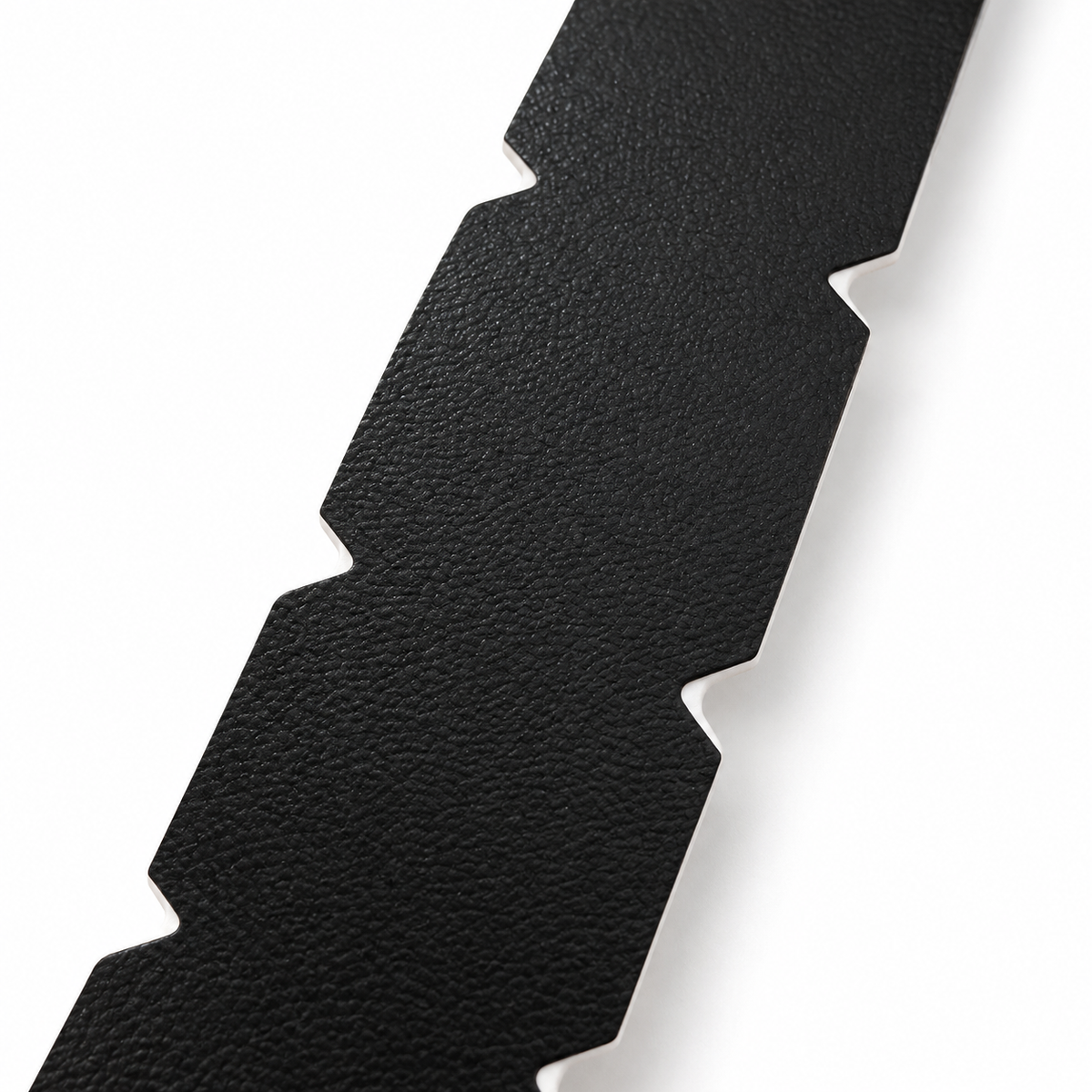Close-up of the textured surface and pre-cut side notches on black WPS pickleball edge tape