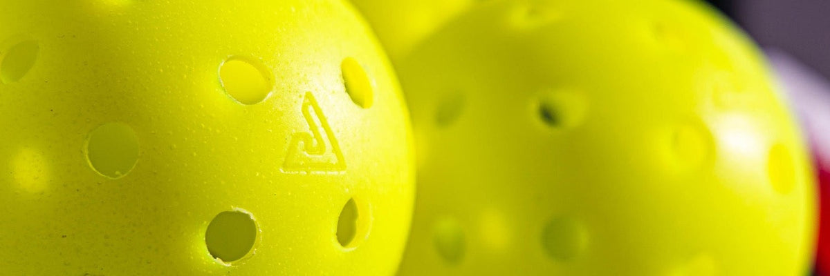 JOOLA outdoor pickleballs on court