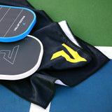 Paddletek Performance Towel with yellow logo on a pickleball court