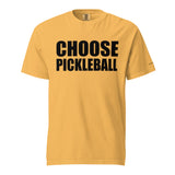 Mustard Choose Pickleball Tee on a shaped garment mockup, with bold black CHOOSE PICKLEBALL lettering.