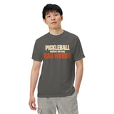 Model wearing the Pepper Bad Words Pickleball Tee, with cream PICKLEBALL lettering and rust BAD WORDS lettering.