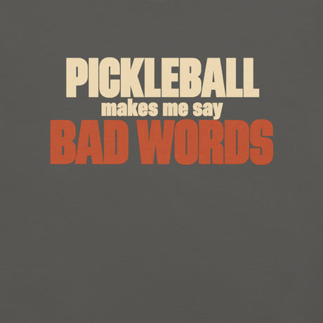 Close-up of the Bad Words Pickleball Tee's cream PICKLEBALL lettering and rust BAD WORDS lettering.