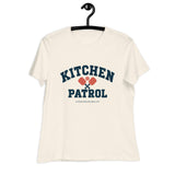 Natural Kitchen Patrol Women's Tee on a hanger, with collegiate KITCHEN PATROL lettering.