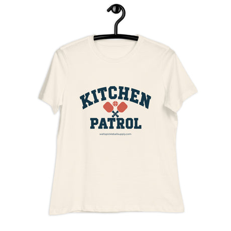 Natural Kitchen Patrol Women's Tee on a hanger, with collegiate KITCHEN PATROL lettering.