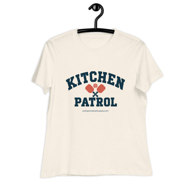 Natural Kitchen Patrol Women's Tee on a hanger, with collegiate KITCHEN PATROL lettering.