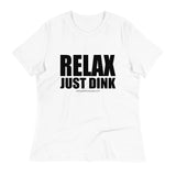 White Relax Just Dink Women's Tee in a textured flat lay, with bold black RELAX JUST DINK lettering.