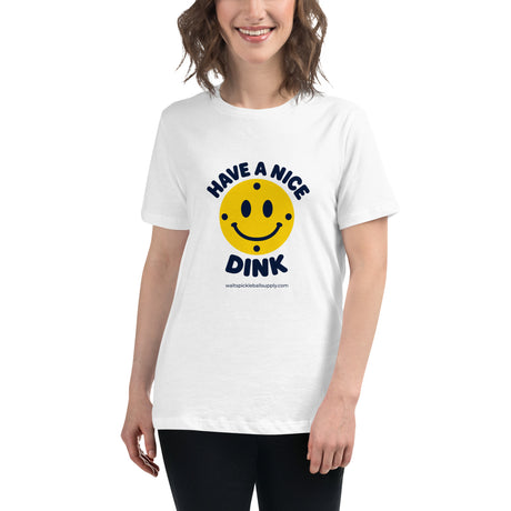 White Nice Dink Women's Tee modeled from the front, with a smiling yellow pickleball graphic.