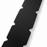 Close-up of the textured surface and pre-cut side notches on black WPS pickleball edge tape