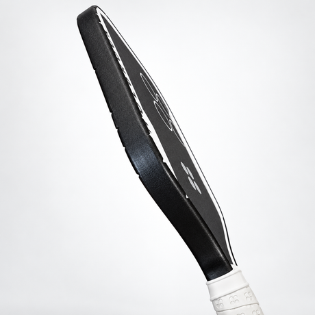 Side profile of black WPS edge tape installed along the perimeter of a pickleball paddle